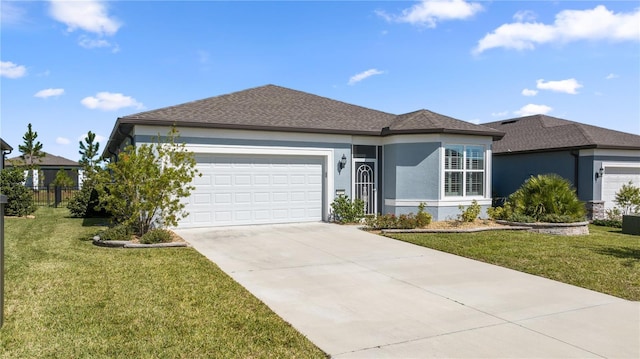 ranch-style house featuring a front lawn and a garage