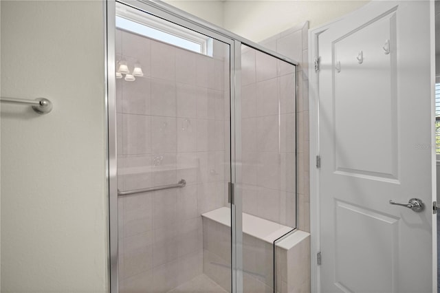 bathroom with a shower with shower door