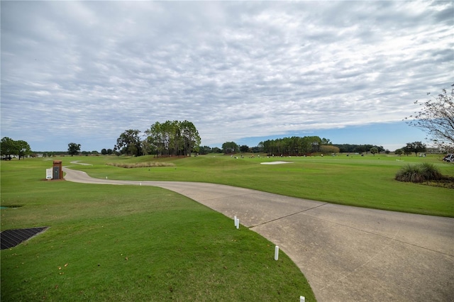 surrounding community featuring a lawn