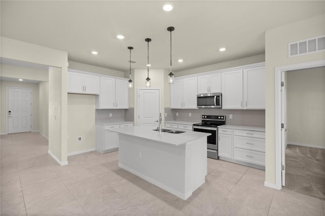 kitchen featuring a kitchen island with sink, appliances with stainless steel finishes, sink, and white cabinetry