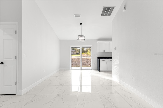 unfurnished living room with lofted ceiling