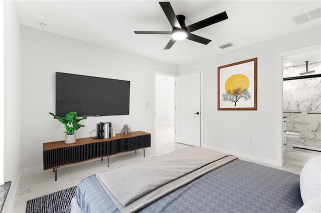 bedroom featuring ceiling fan and ensuite bath