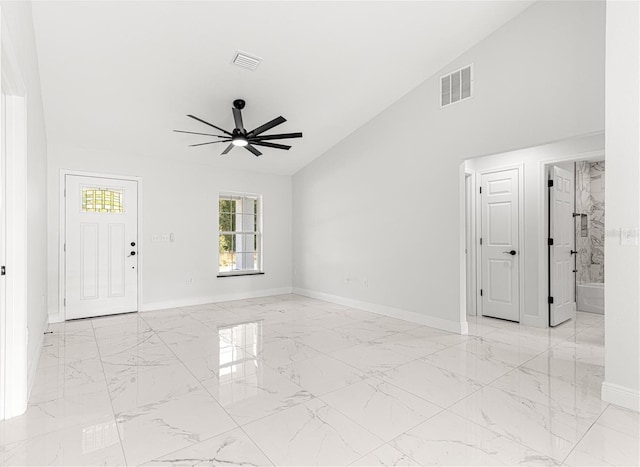 spare room featuring vaulted ceiling and ceiling fan