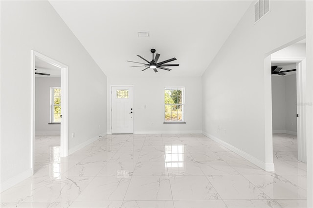 interior space featuring ceiling fan and a healthy amount of sunlight