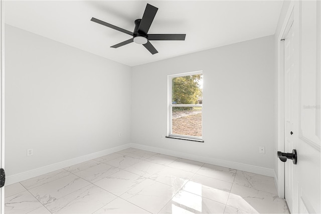 spare room with ceiling fan