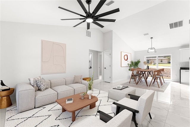 living room with ceiling fan and lofted ceiling