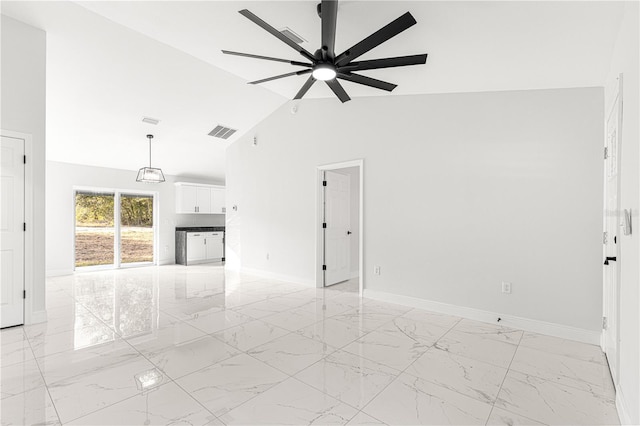 unfurnished living room with lofted ceiling and ceiling fan