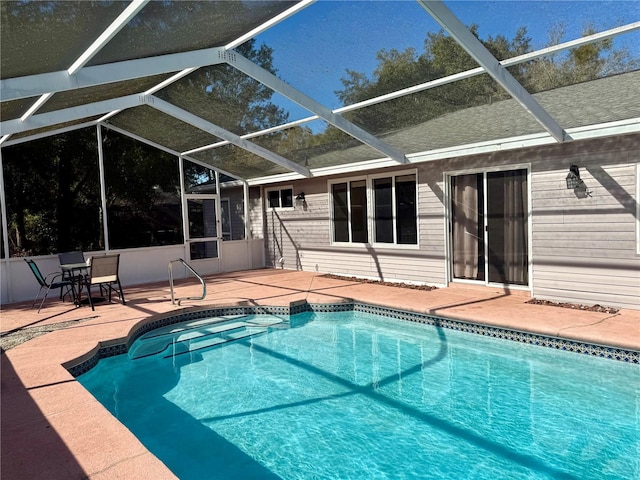 outdoor pool featuring a lanai and a patio