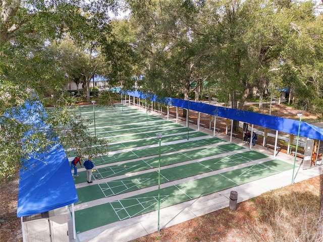 view of property's community featuring shuffleboard