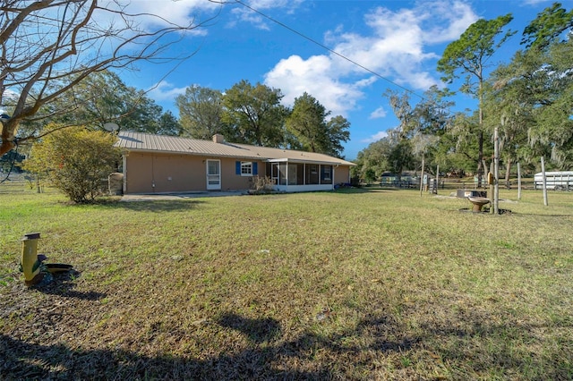 view of yard featuring a sunroom