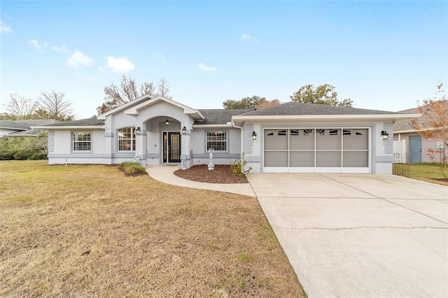 ranch-style home with a front yard and a garage