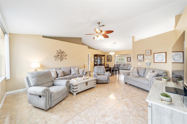 living room with ceiling fan and vaulted ceiling