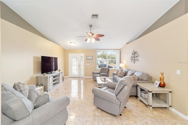 living room featuring ceiling fan and vaulted ceiling