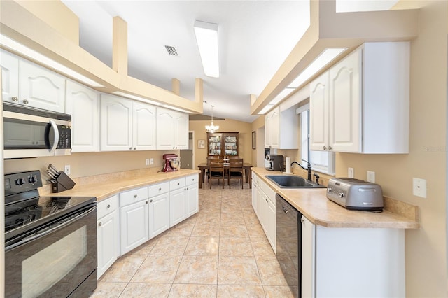 kitchen featuring black appliances, white cabinets, decorative light fixtures, and sink