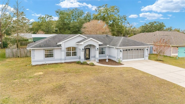 ranch-style house featuring a front lawn and a garage