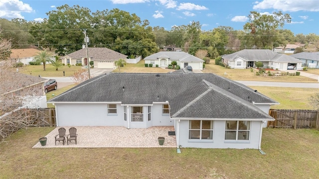 rear view of property with a patio area and a lawn