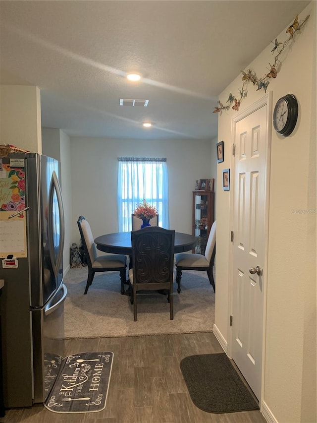 dining area with hardwood / wood-style floors