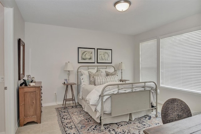 bedroom with light tile patterned floors