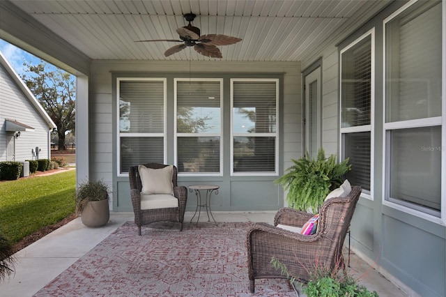 view of patio featuring ceiling fan