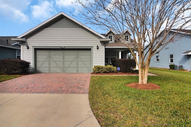 view of front facade with a garage and a front yard