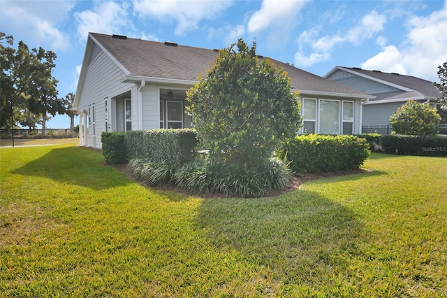 view of home's exterior featuring a yard