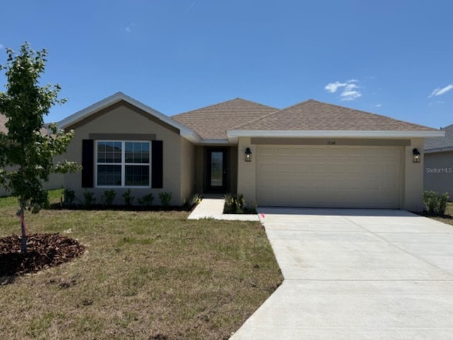 2158 NW 23rd Loop, Ocala, FL 34475 - single story home with a front yard, concrete driveway, an attached garage, a shingled roof, and stucco siding