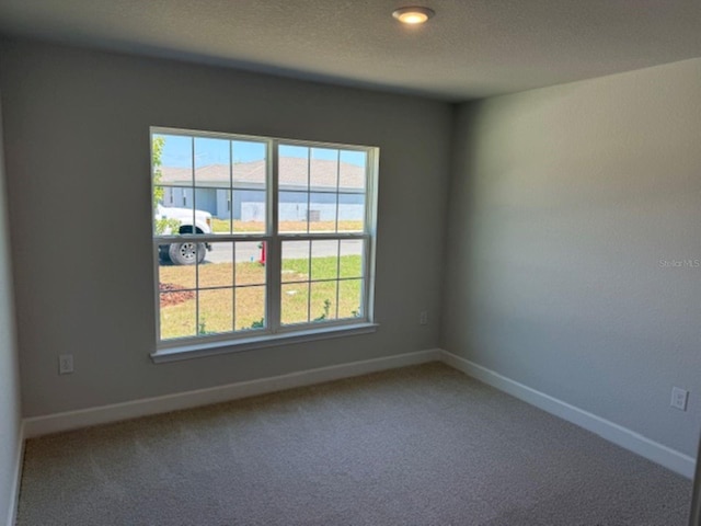 2158 NW 23rd Loop, Ocala, FL 34475 - unfurnished room featuring baseboards and carpet flooring