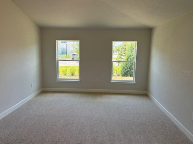 2158 NW 23rd Loop, Ocala, FL 34475 - empty room with baseboards and light colored carpet