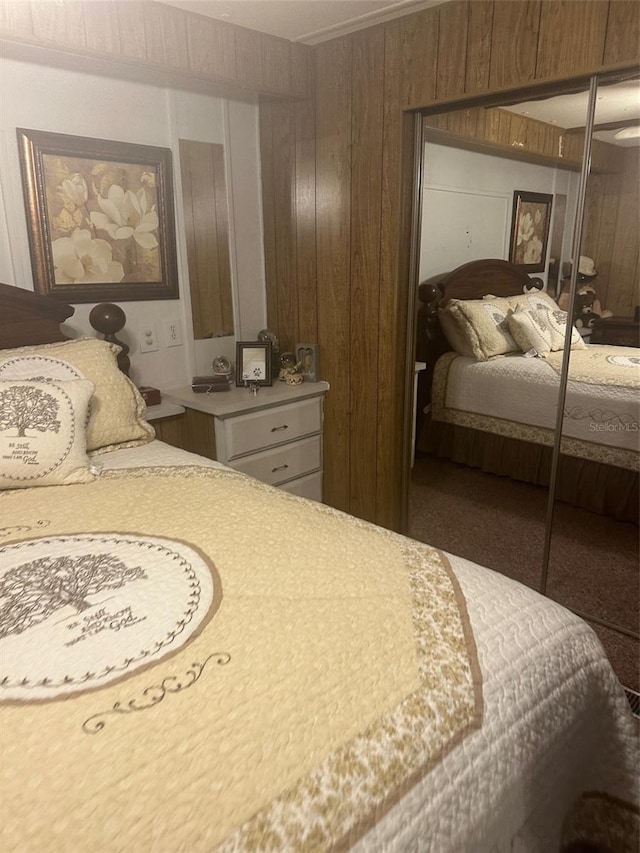 480 NE 64th Ave, Ocala, FL 34470 - bedroom featuring wooden walls, a closet, and carpet