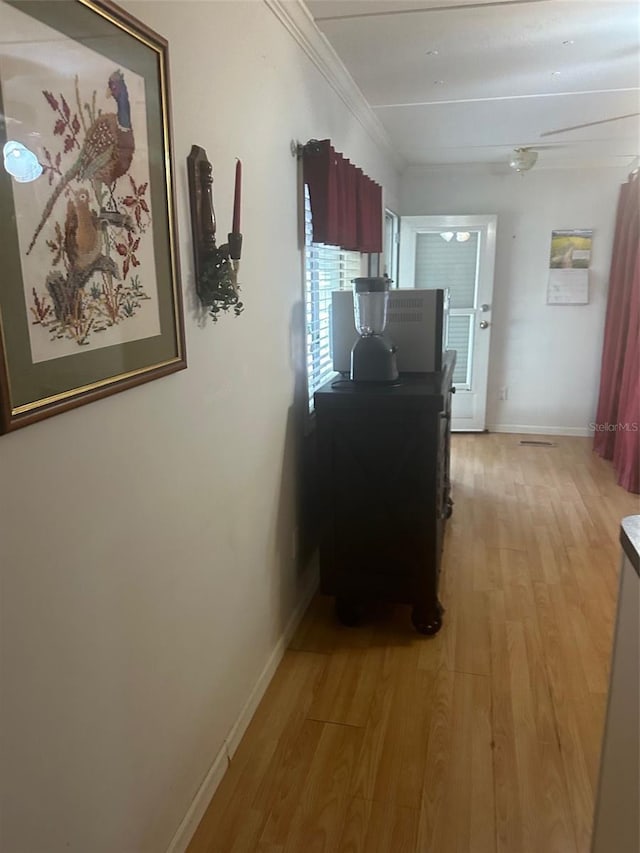 480 NE 64th Ave, Ocala, FL 34470 - hallway featuring light wood-style flooring, baseboards, and crown molding