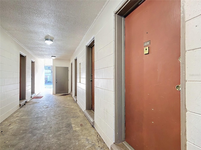 corridor with a textured ceiling