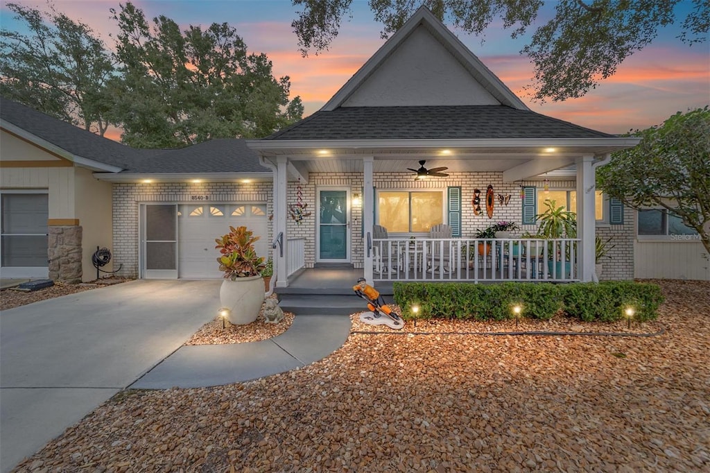 craftsman house featuring ceiling fan, a garage, and a porch