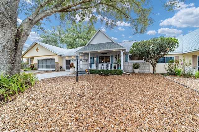 view of front of property featuring a porch and a garage