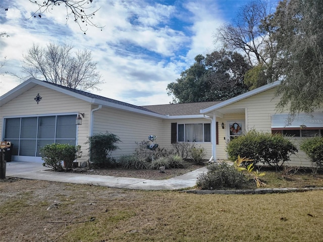 single story home with a front lawn and a garage