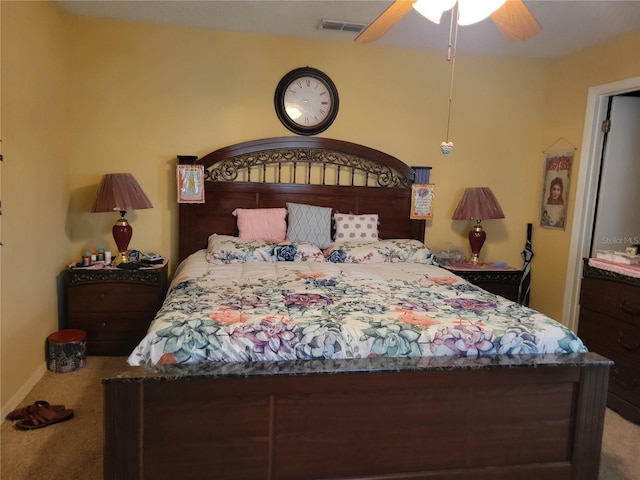 bedroom featuring ceiling fan and carpet