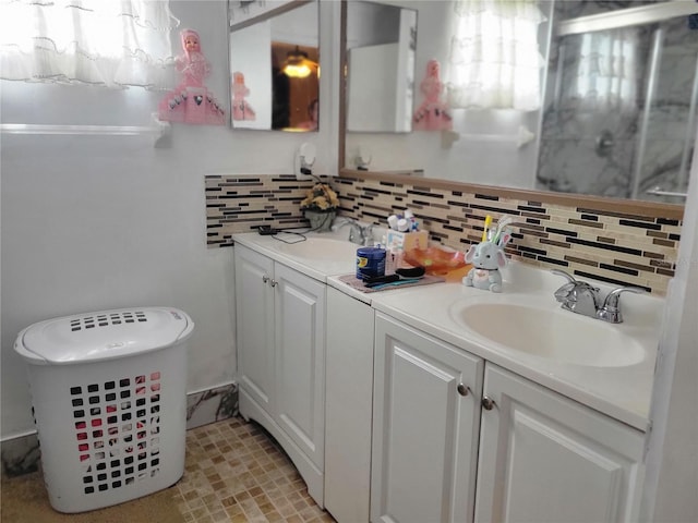 bathroom with decorative backsplash and vanity