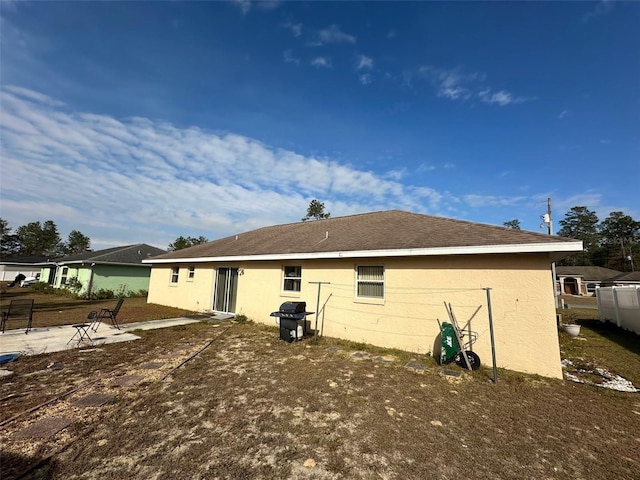 rear view of property with a patio area