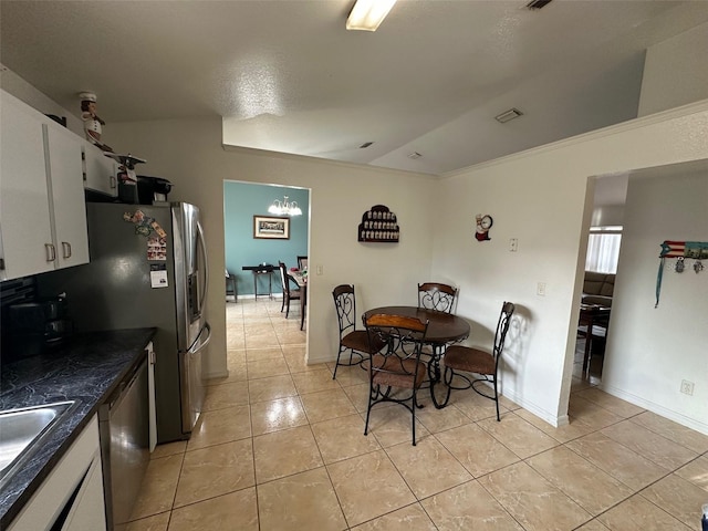 dining space featuring light tile patterned flooring