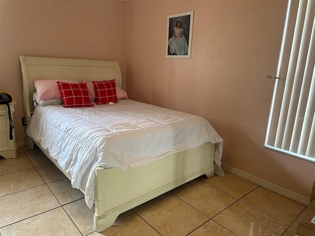 bedroom featuring light tile patterned floors