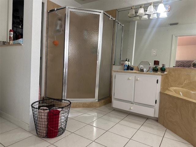 bathroom with separate shower and tub and tile patterned flooring