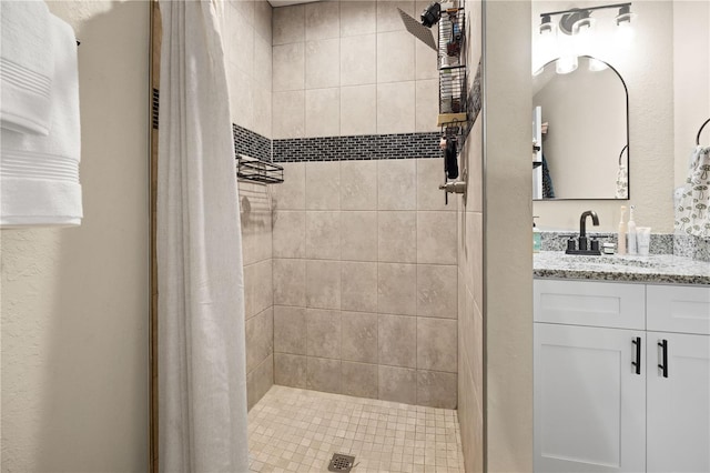 bathroom featuring a shower with curtain and vanity