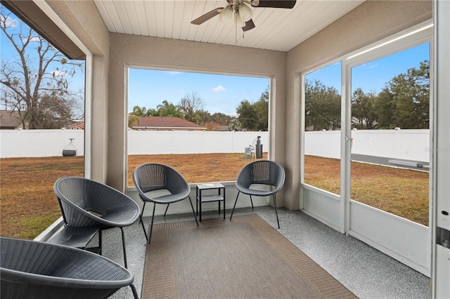 sunroom / solarium with ceiling fan and plenty of natural light