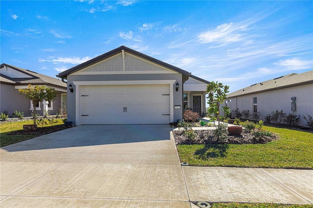 view of front of home with a front lawn and a garage