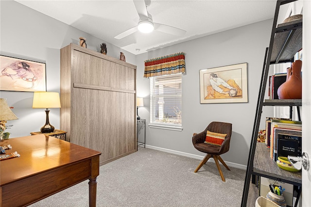 home office with ceiling fan and light colored carpet