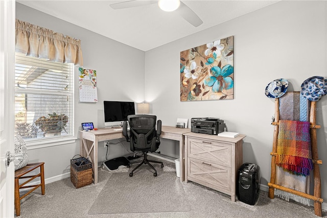 carpeted office with ceiling fan