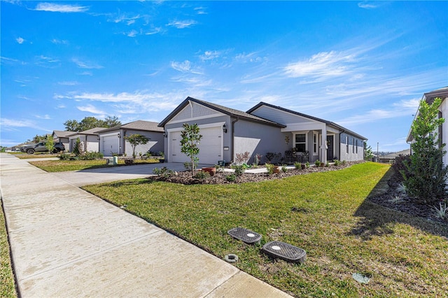 ranch-style house featuring a front yard and a garage