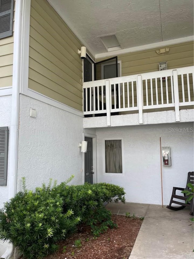 doorway to property featuring a balcony