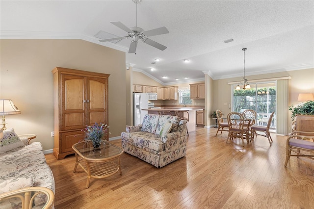 living room with crown molding, light hardwood / wood-style flooring, a textured ceiling, ceiling fan with notable chandelier, and vaulted ceiling