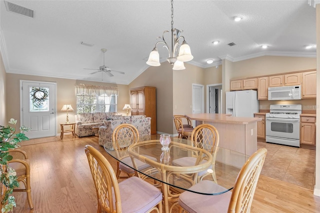 dining area with crown molding, vaulted ceiling, a textured ceiling, light wood-type flooring, and ceiling fan with notable chandelier