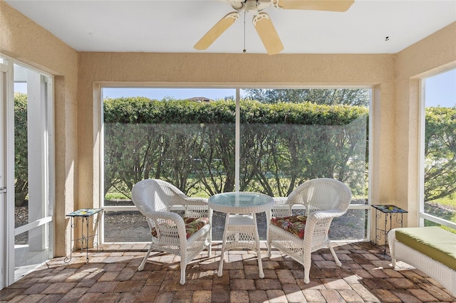 sunroom / solarium with ceiling fan